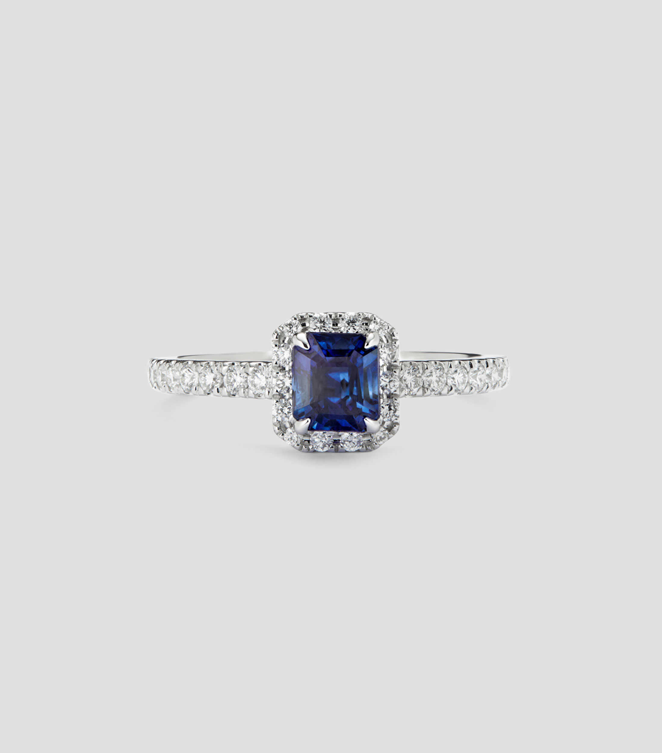 Anillo solitario en Oro blanco de 18 Kilates con zafiro azul y diamantes Mujer